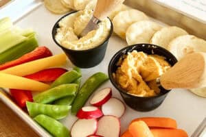 Hummus plate with fresh vegetables and toasted pita bread at Coastal Isles Wine Bar